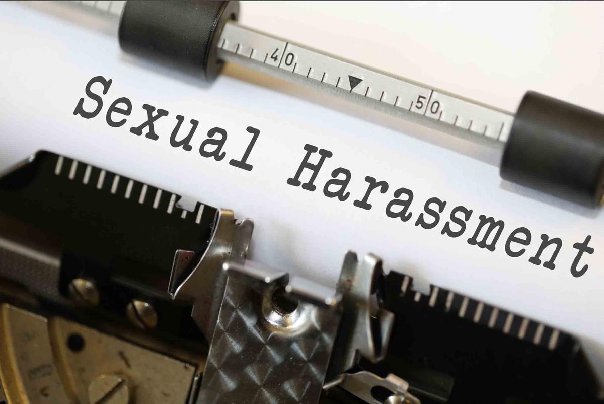 The words sexual harassment being written on a typewriter