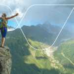 woman on mountain looking at VinciWorks logo