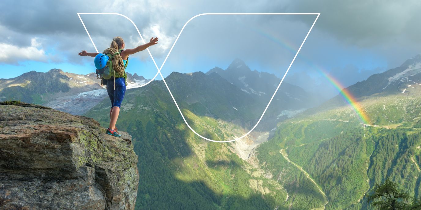 woman on mountain looking at VinciWorks logo